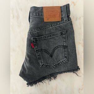 Levis 501 shorts in Black denim. Barely worn, like new. Size 23.